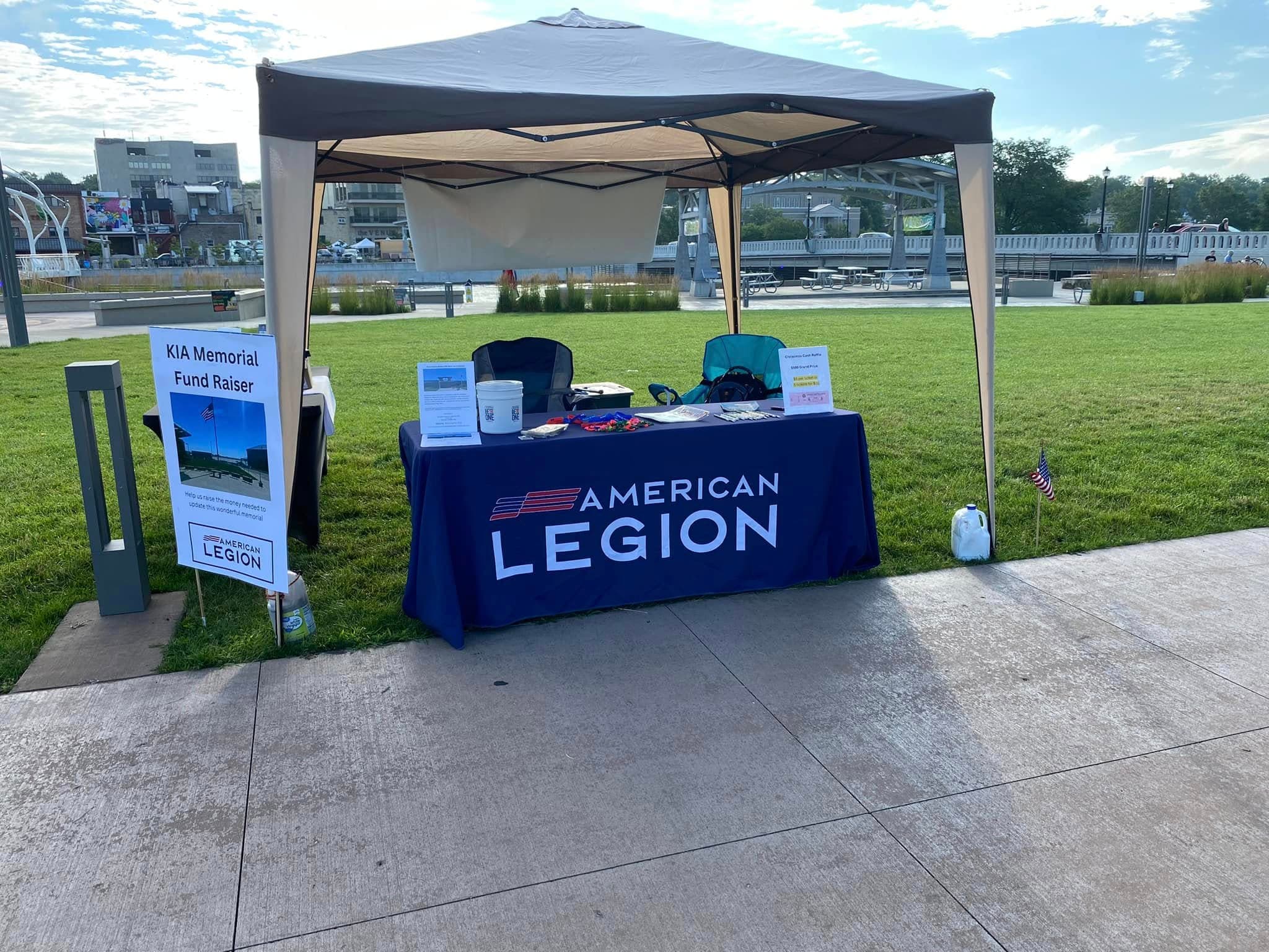 Post 205 booth with American Legion table cloth and KIA Memorial fundraiser sign